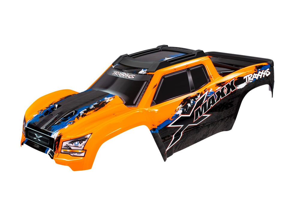 Body, X-Maxx®, orange (painted, decals applied) (assembled with front & rear body mounts, rear body support, and tailgate protector)